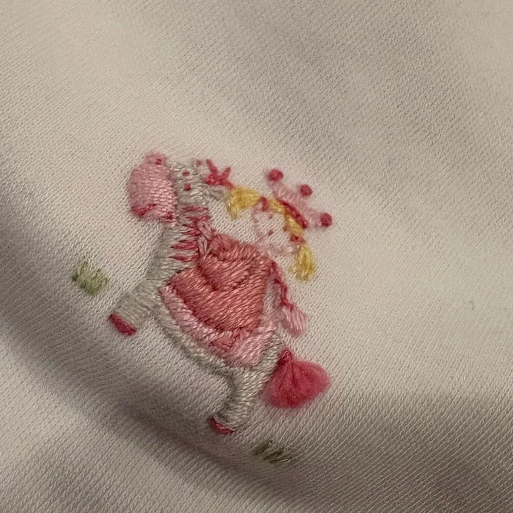 NWOT Kissy Kissy Premier Hand Embroidered Princess Bib